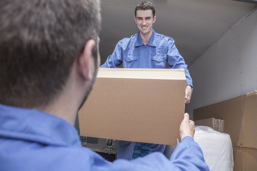 Moving boxes and furniture in Greenwich residential area