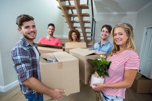 Removal team preparing a Greenwich home move near riverside properties