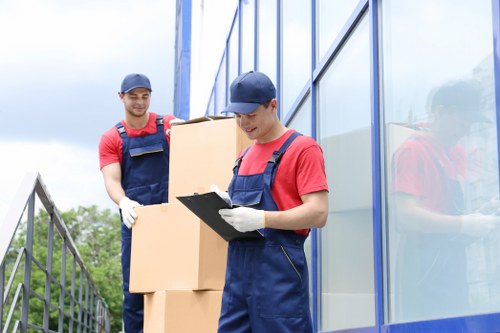 Removal team loading boxes into a vehicle