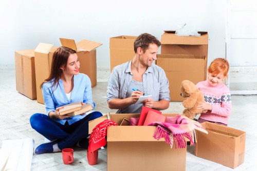 Local moving team assisting with household items and boxes in Greenwich