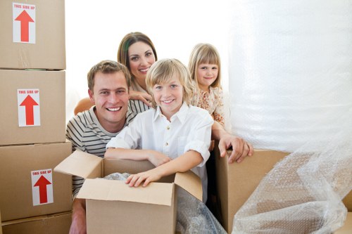 House moving service unloading boxes and furniture at a new Greenwich home