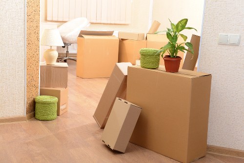 Trained removals crew handling furniture carefully in a property