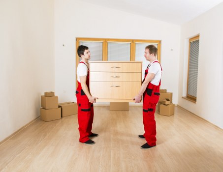Professional office movers handling desks, boxes, and equipment in Greenwich