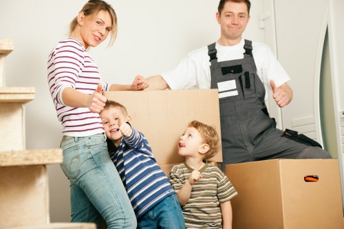 Professional movers handling a flat removal in Greenwich with care